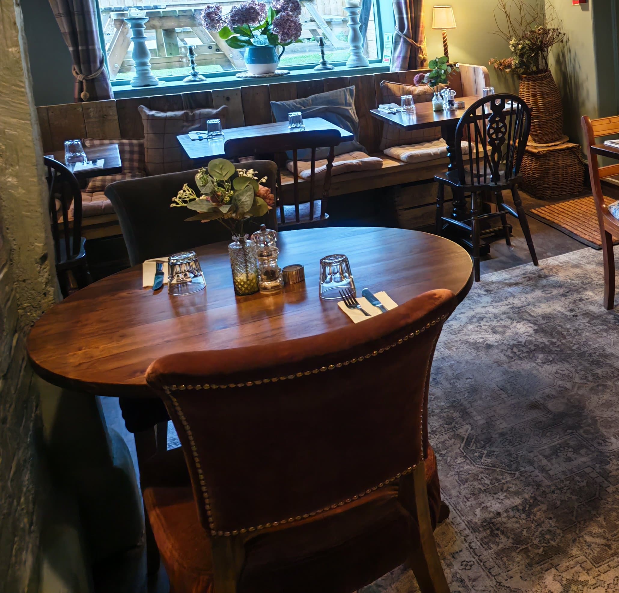 Cosy laid dining table at The Windmill Inn